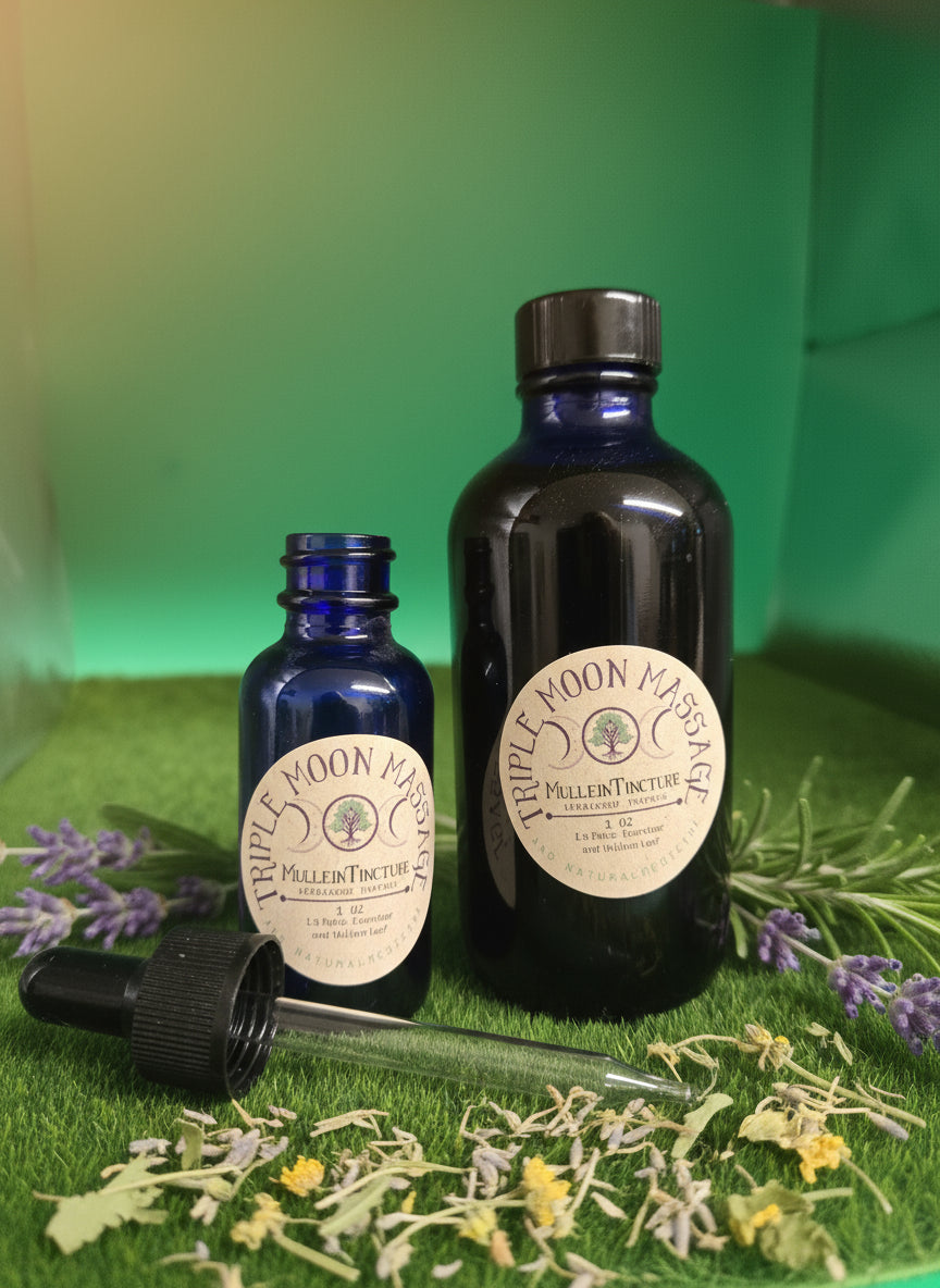 Two small bottles with labels on a green surface