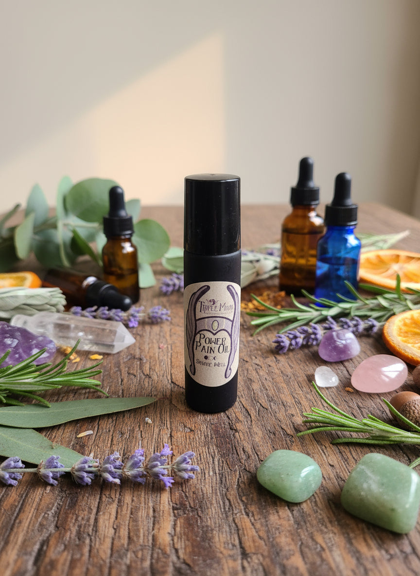 Roll-up bottle with herbs and crystals on a wooden surface