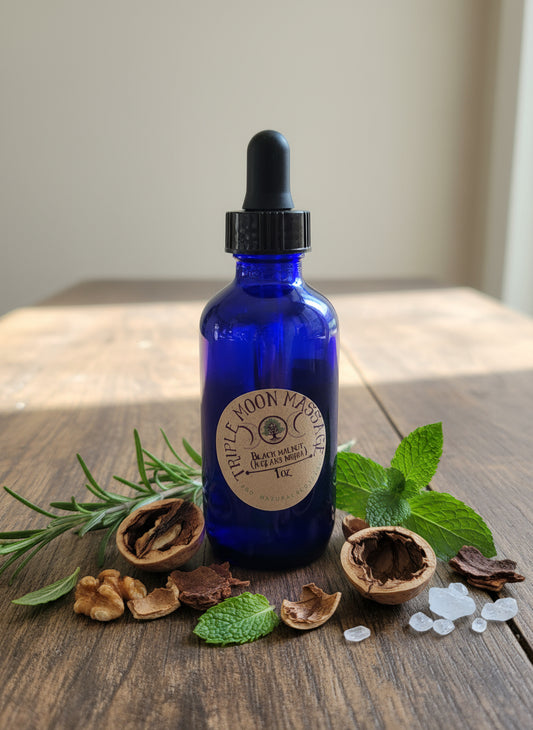 Blue glass bottle with a gold label on a green background