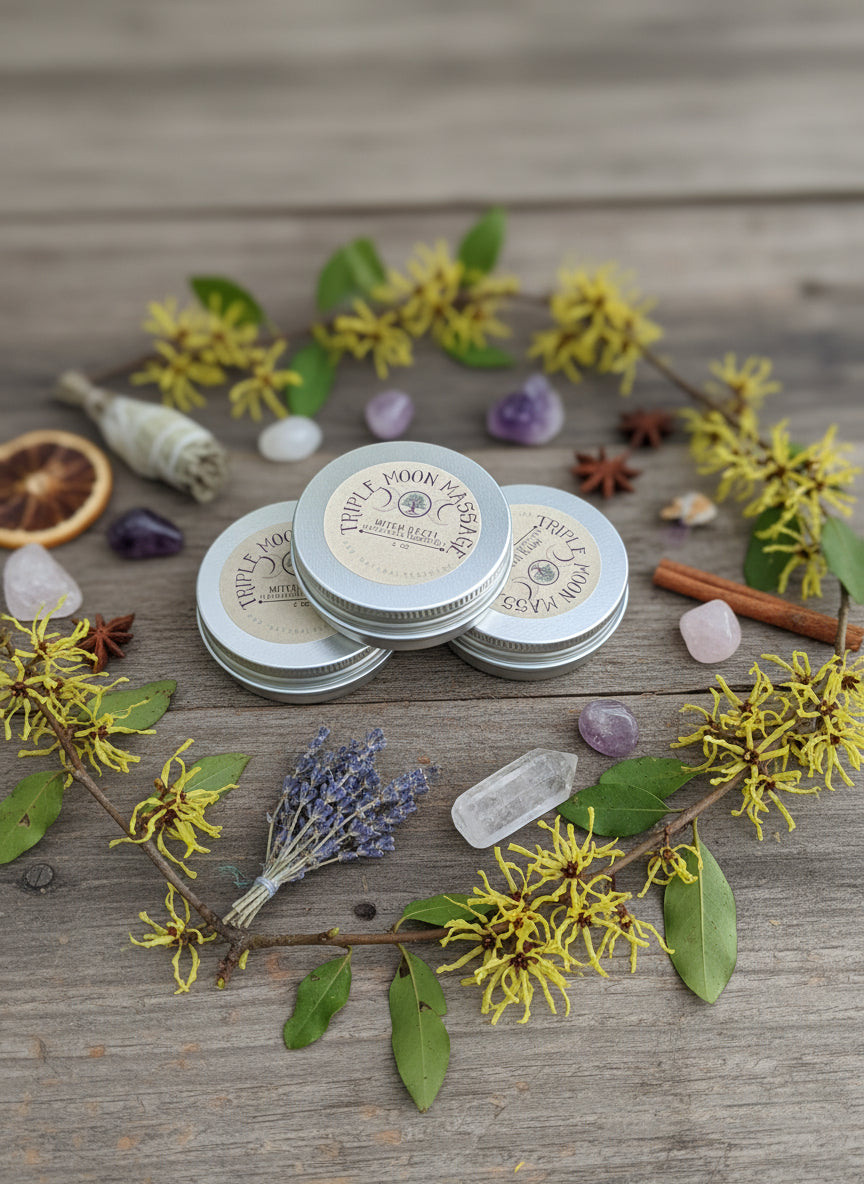 Three tins of Three Moon Apothecary product on a green surface