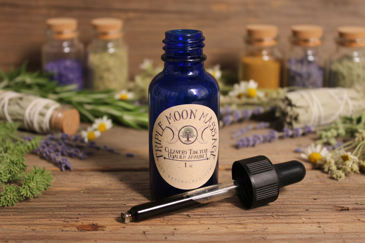 Blue glass bottle with a dropper labeled 'Moon Massage' on a green background