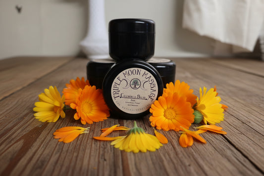 Black jar with a label on a white surface